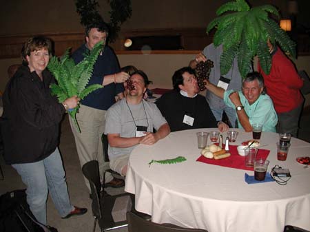 Robin McDermott, Charlie Cook, Denny Dedmore, Tim Barham, Simon Price (behind fern), Mike Cline, Andrew Gould (behind fern)